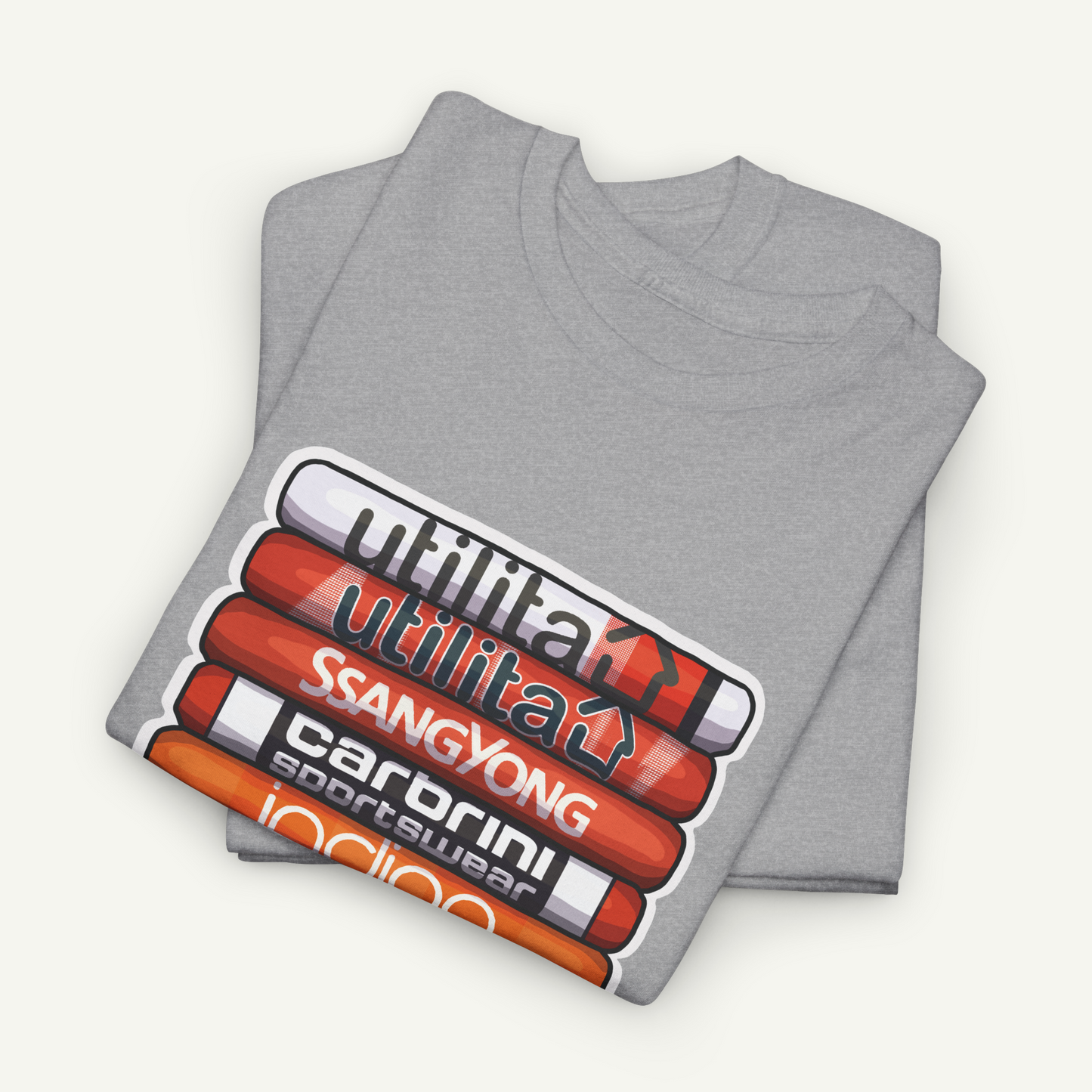 A gray t-shirt with a graphic design featuring a stack of colored pencils with various text written on them.