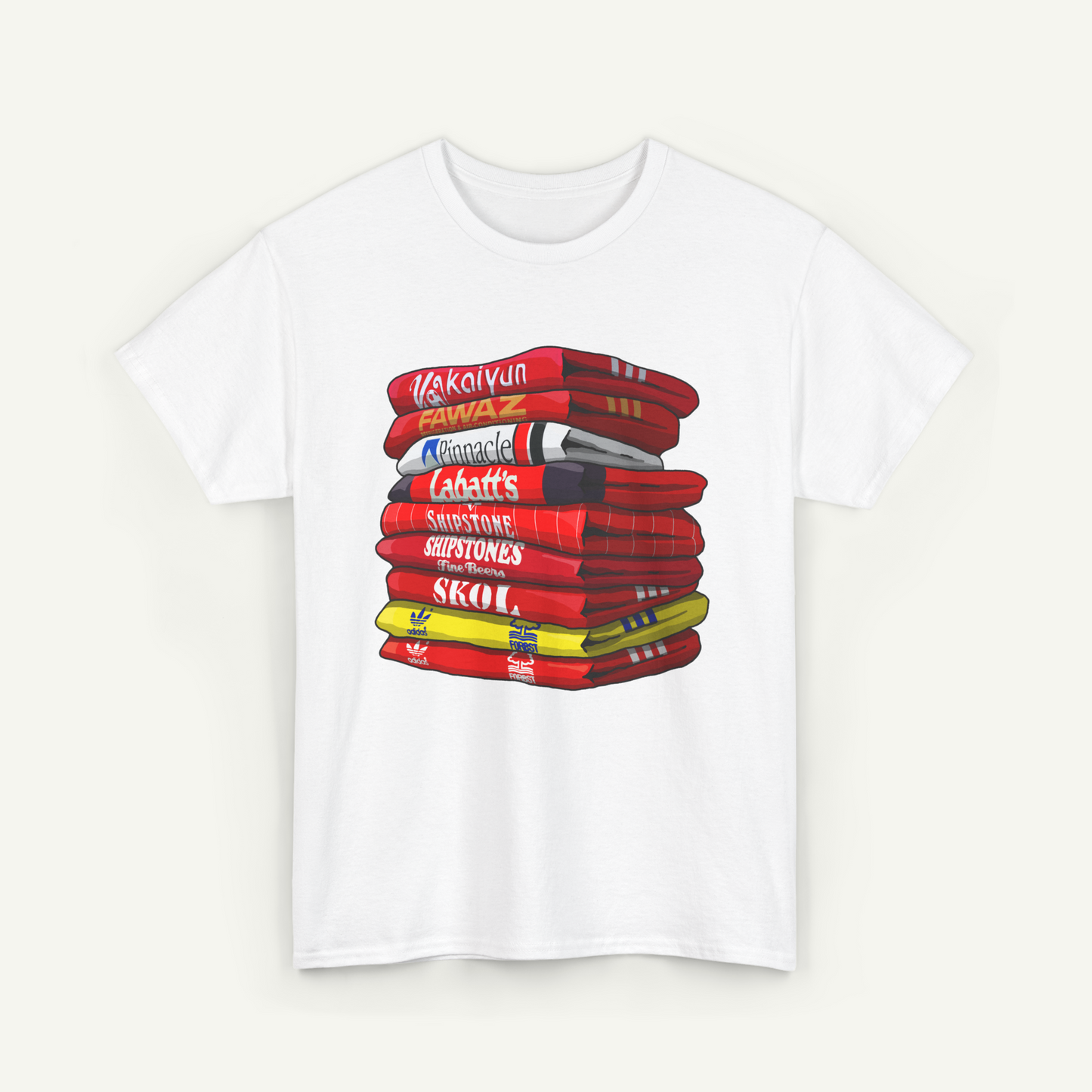 A white t-shirt with a graphic design depicting a stack of books or books, with various text labels on the spines.