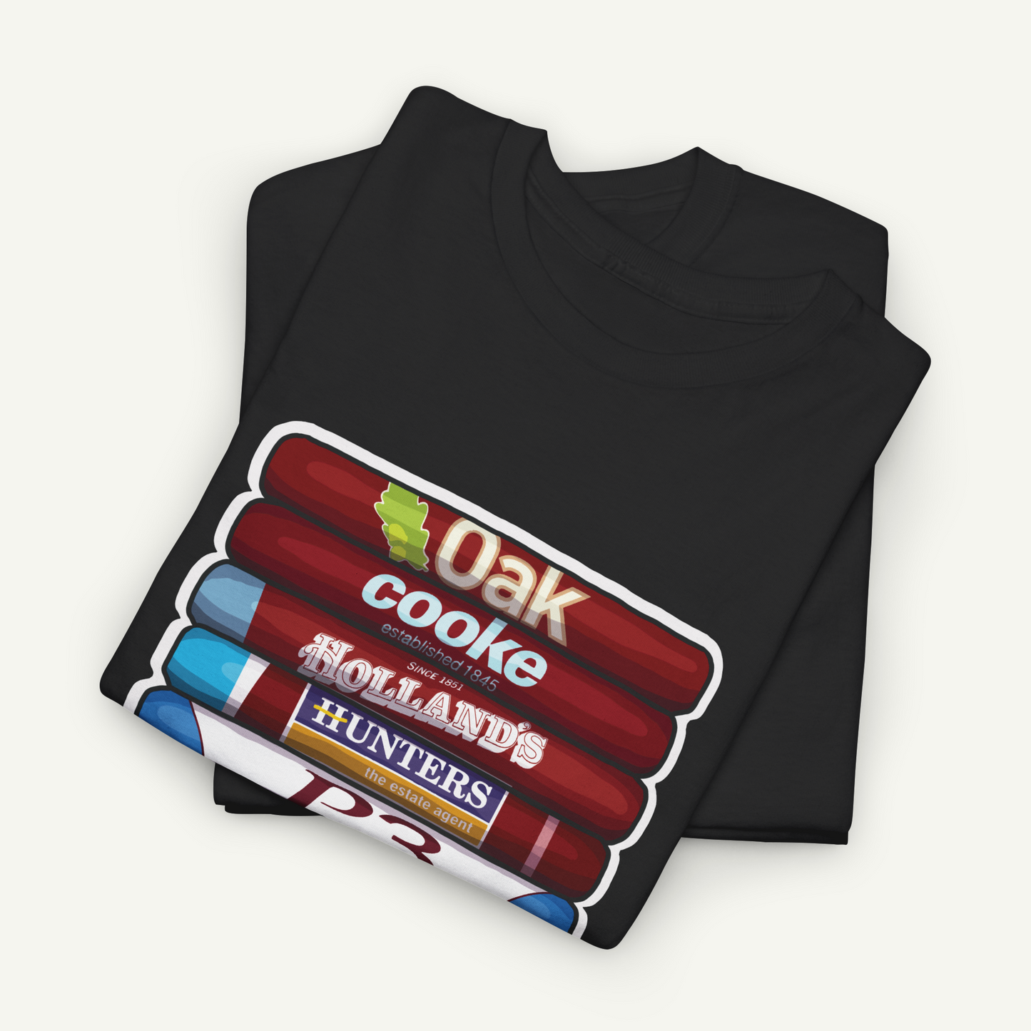 A black t-shirt with a graphic design featuring a stack of colorful tubes or tubes with text printed on them.