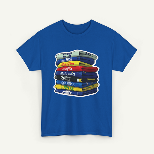 A blue t-shirt with a graphic design depicting a stack of books or books, with each book having a different color and title.