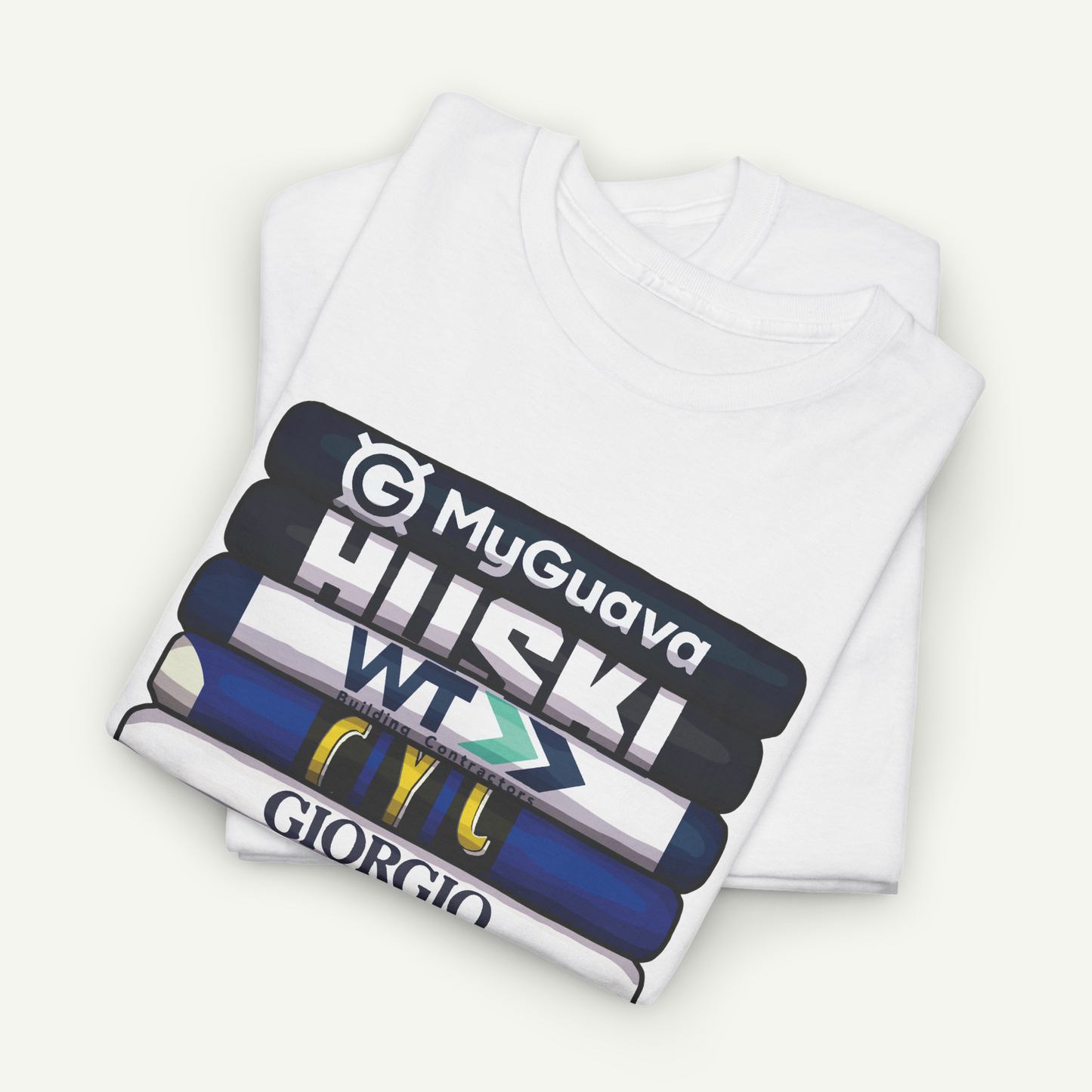 A white t-shirt with a graphic design featuring a stack of books with various text and logos printed on them.