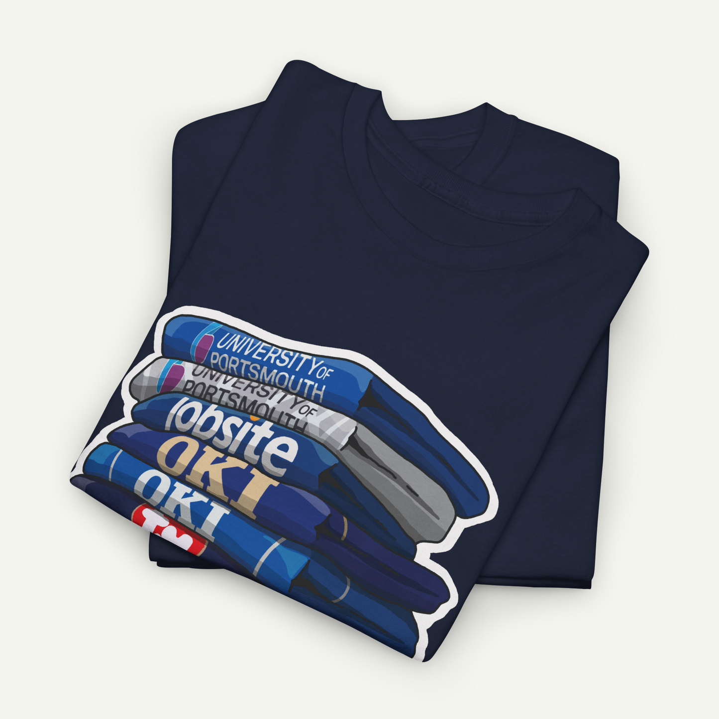 A navy blue t-shirt with a graphic design depicting a stack of books, with the text "University of Portsmouth for Portsmouth" printed on the books.