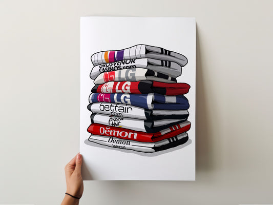 A hand is holding a poster with a stack of colorful towels, each with a different word written on it.