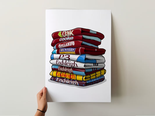 A hand is holding a poster with a stack of colorful towels, each with a different word written on it.