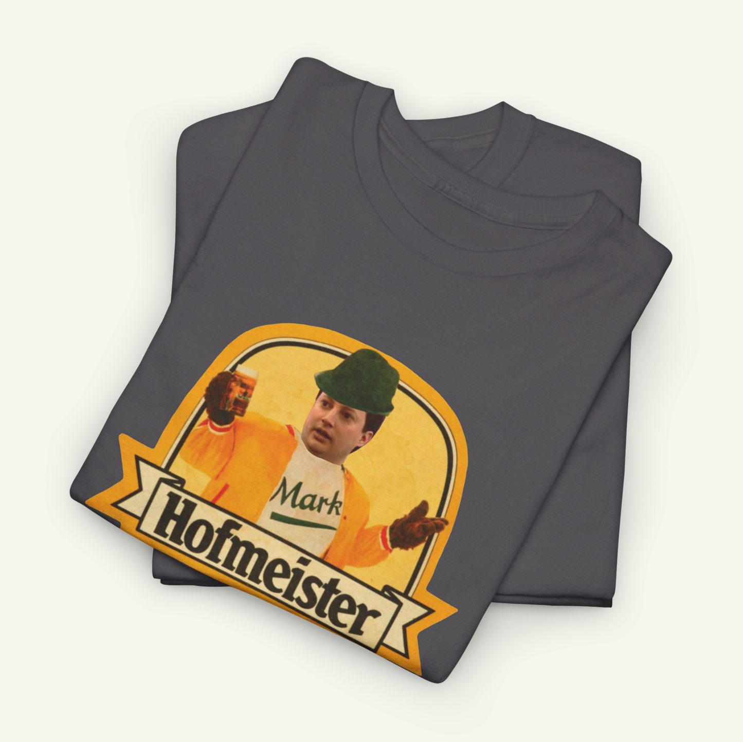 a gray t-shirt with a graphic design depicting a man wearing a hat and a jacket, along with the text "Hofmeister" printed on it.