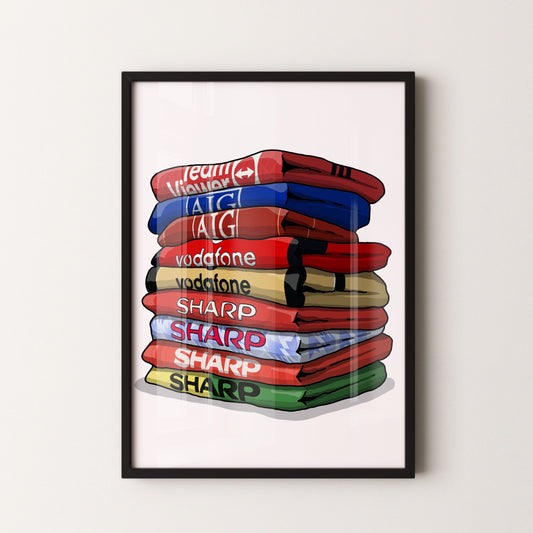A framed illustration of a stack of colorful towels with various text on them, including "Team Vodafone", "vodafone", "SHARP", "SHARP", and "SHARP".