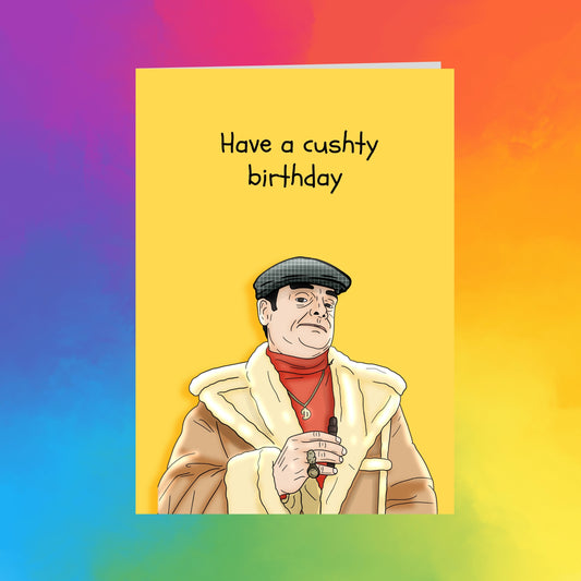 a cartoon illustration of a man wearing a hat and coat, with the text "Have a cushy birthday" written above him.