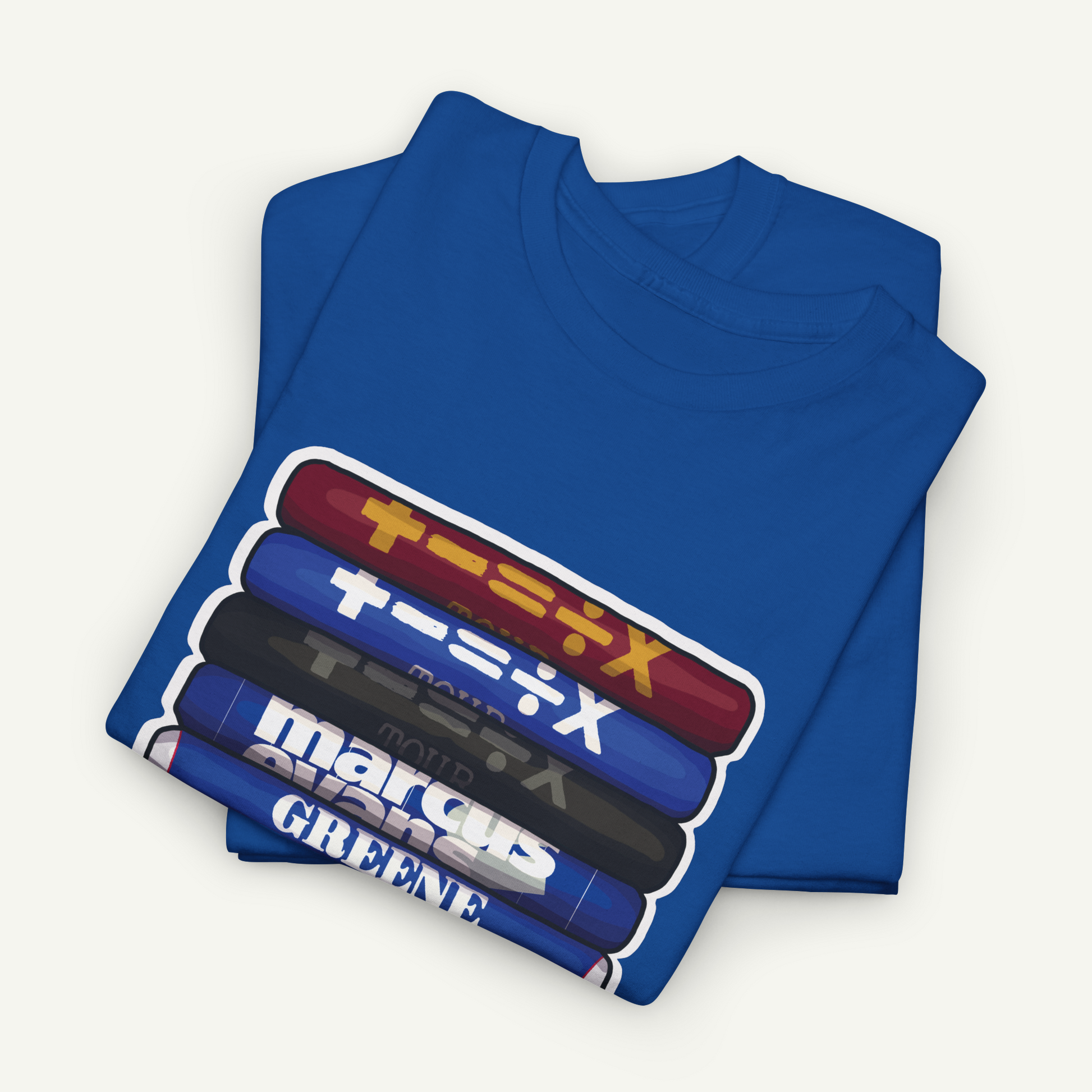 A blue t-shirt with a graphic design featuring a stack of colorful tubes or bottles with Japanese text on them.