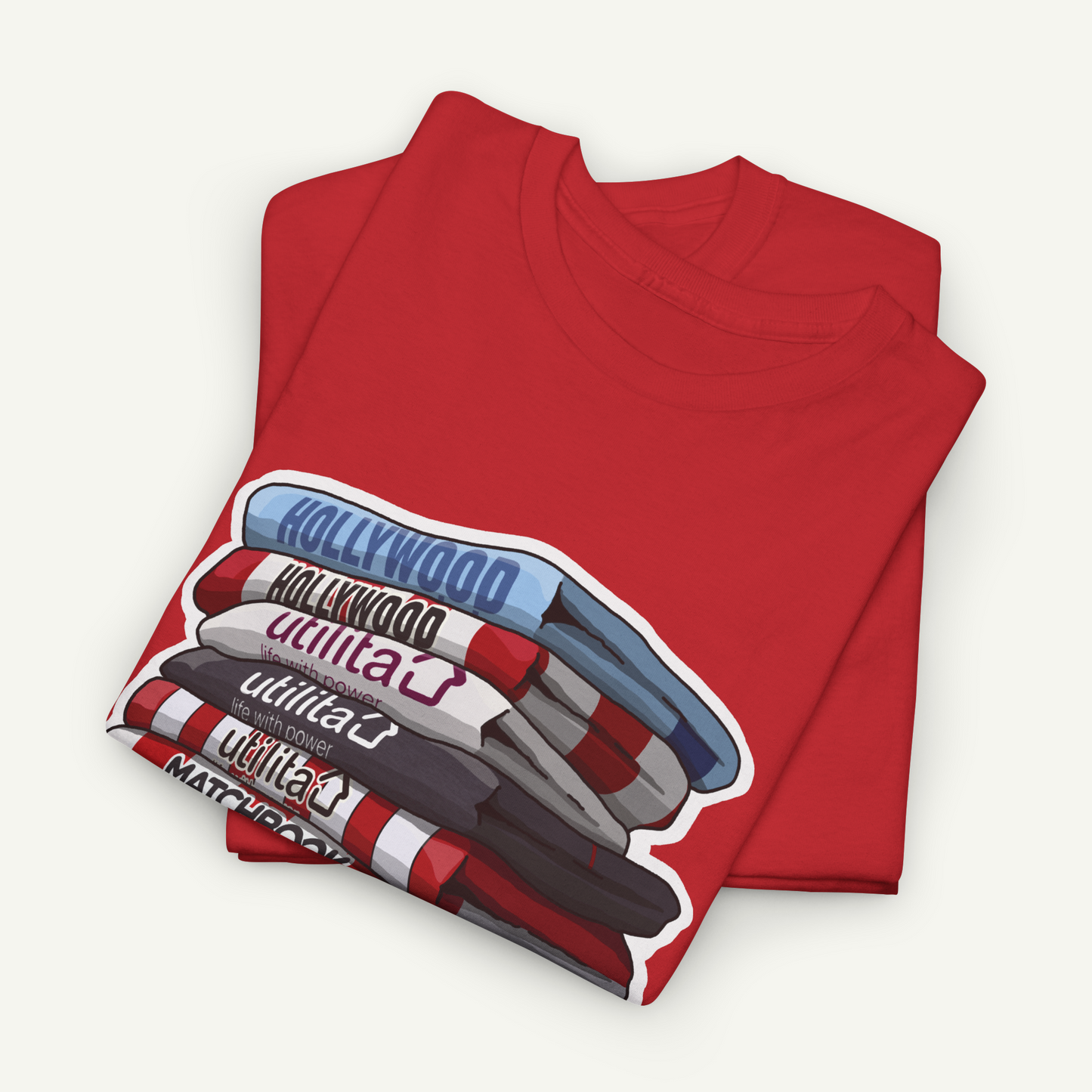 A red t-shirt with a graphic design depicting a stack of colorful markers or pens, with the word "Hollywood" written on the side.