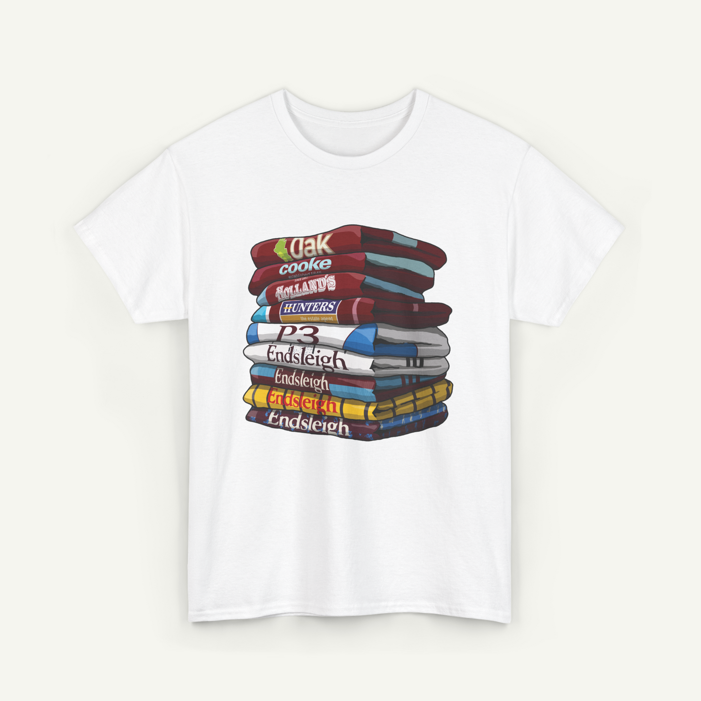 A white t-shirt with a stack of colorful books arranged in a pile.