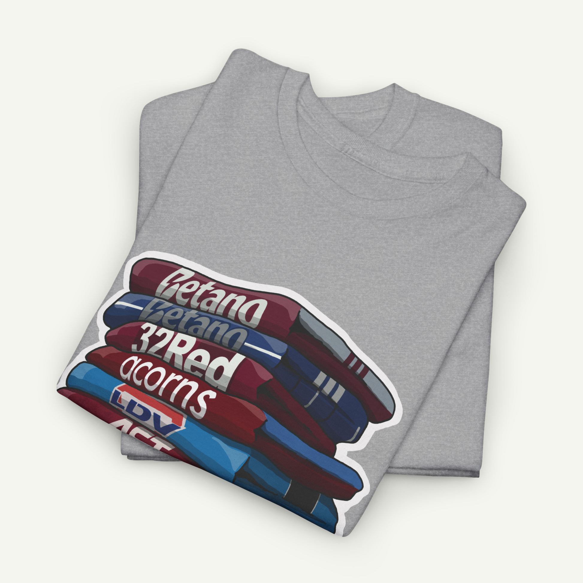A gray t-shirt with a graphic design depicting a stack of books or magazines with the text "Bertano 32Red acorns" printed on them.