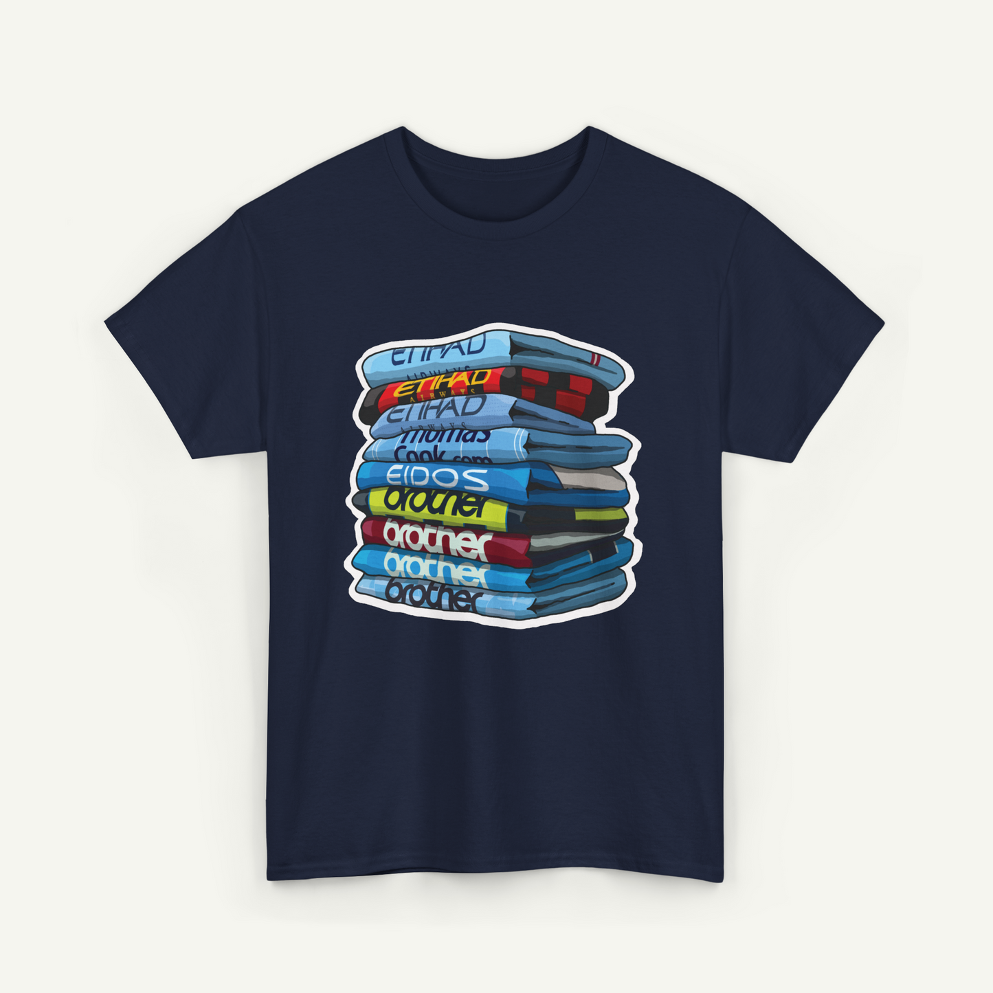 A navy blue t-shirt with a graphic design depicting a stack of colorful books or magazines.
