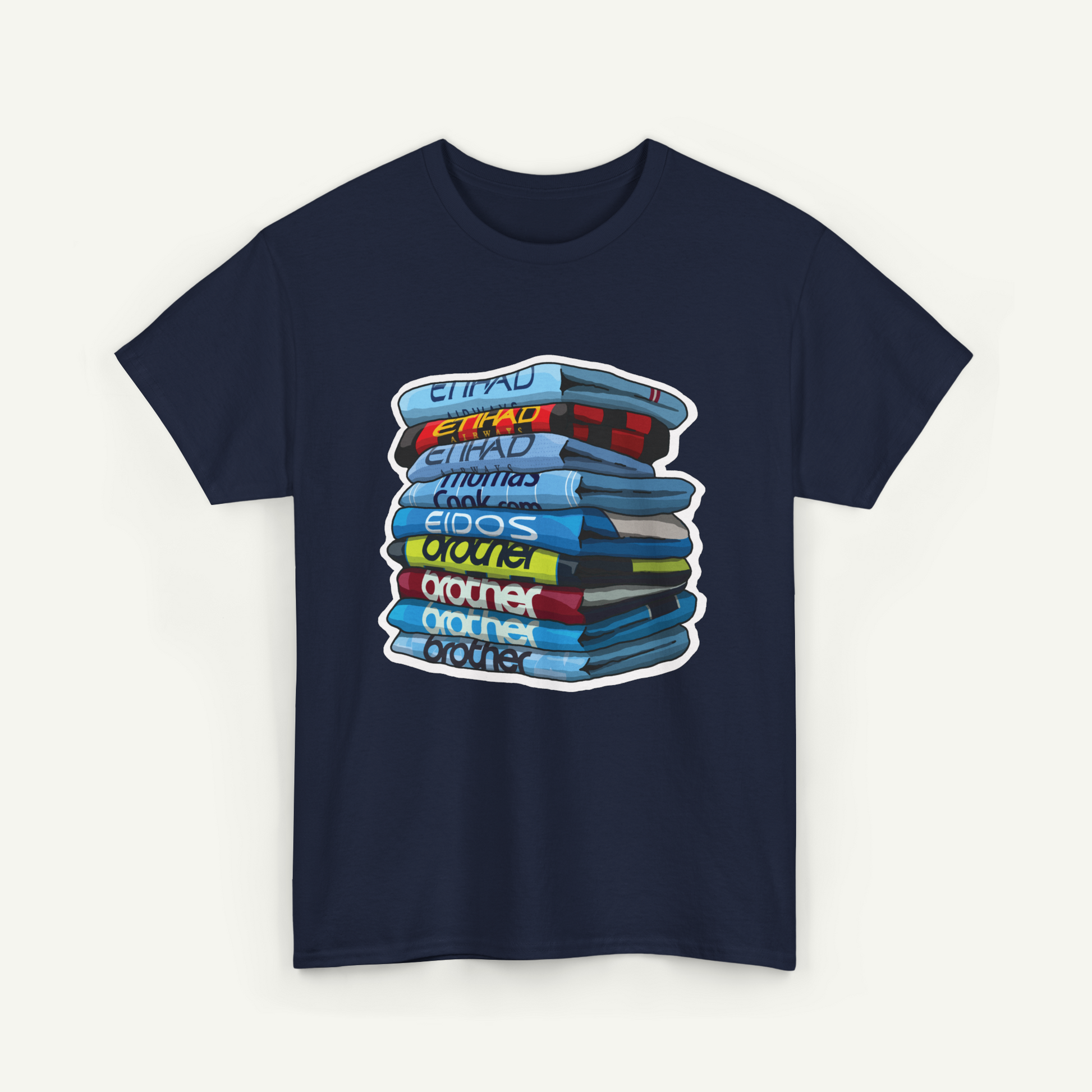 A navy blue t-shirt with a graphic design depicting a stack of colorful books or magazines.