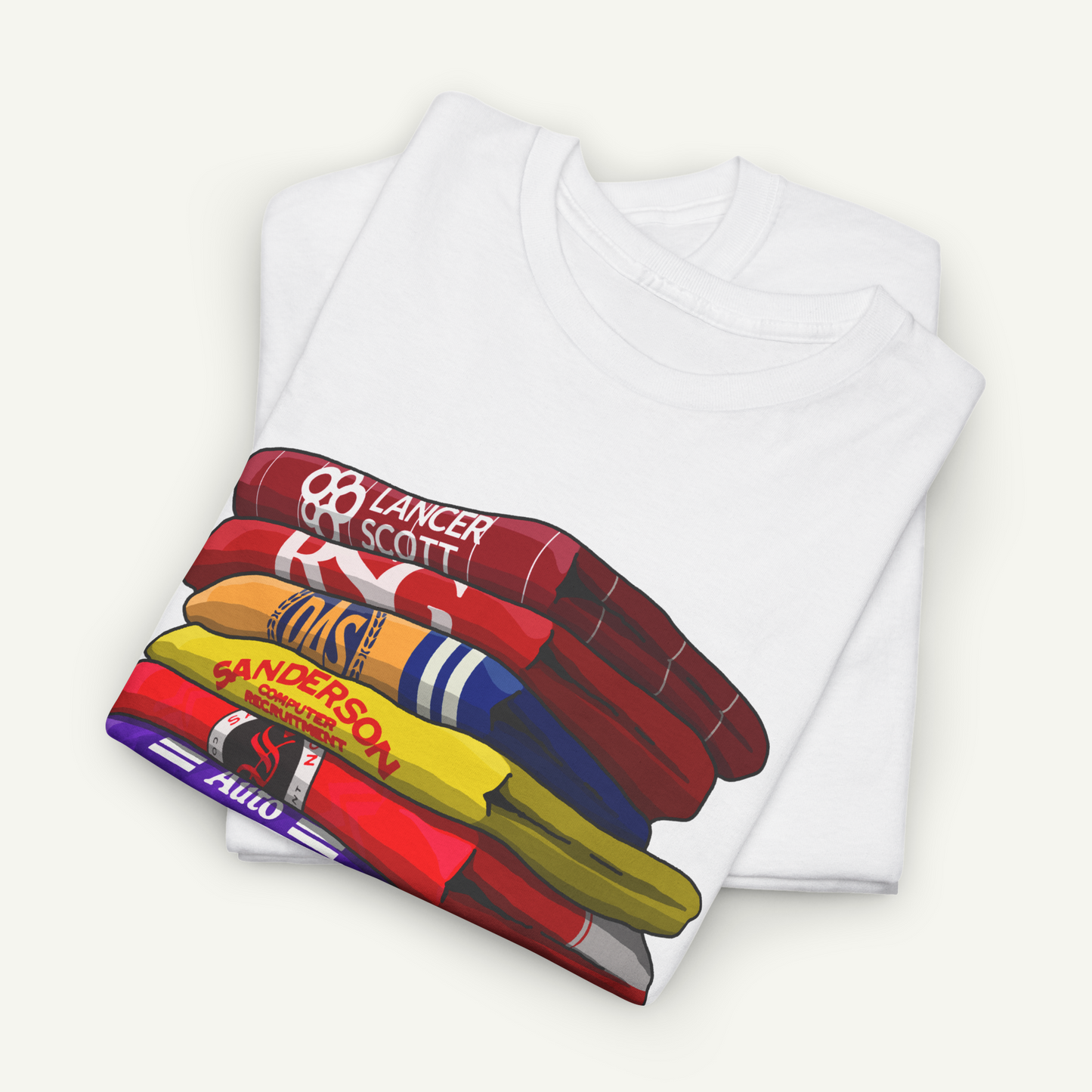 A white t-shirt with a colorful graphic design depicting a stack of various colored objects, such as a red and white striped shirt, a yellow and blue striped shirt, and a red and white striped shirt.