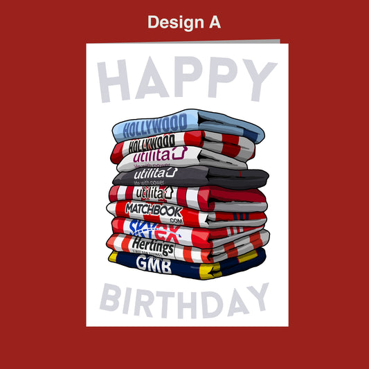 A stack of colorful towels with the text "HAPPY BIRTHDAY" written on them.