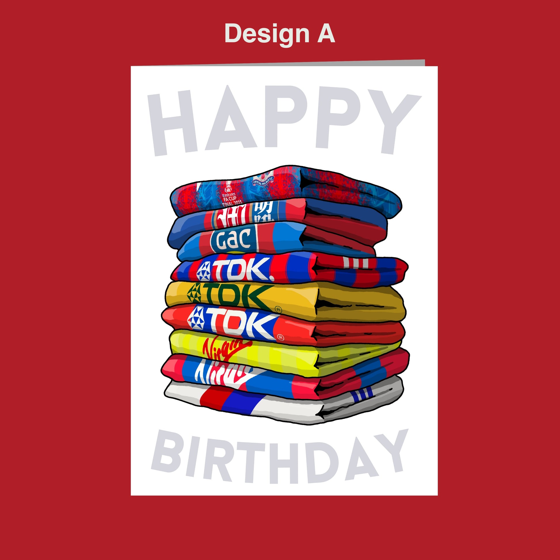 A stack of colorful towels with the text "Happy Birthday" written on them, set against a red background.