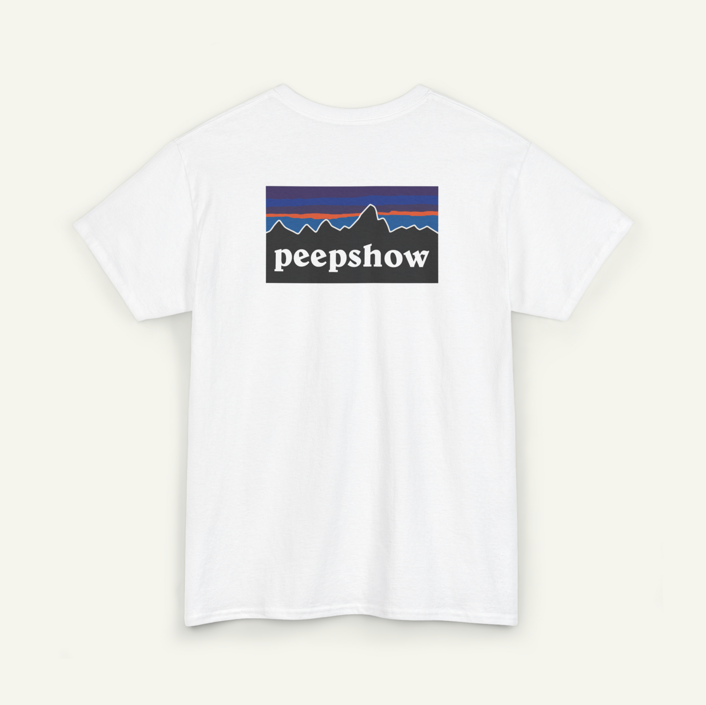 A white t-shirt with a graphic design featuring a mountain range and the word "peepsshow" printed on it.