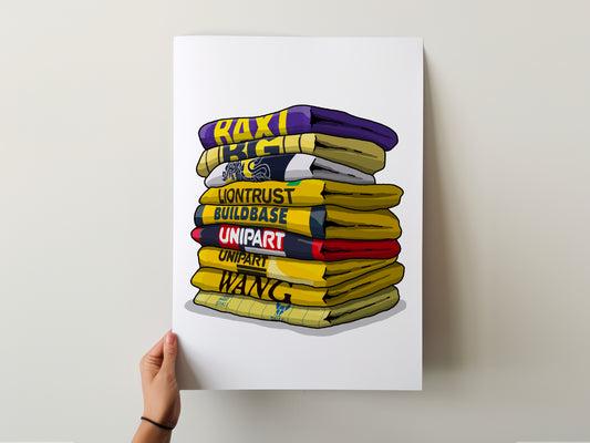 A hand is holding a poster with a stack of colorful towels, each with a different word written on it.