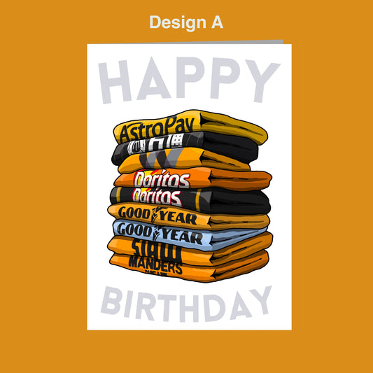 A stack of colorful towels with the text "Happy Birthday" written on them, set against a bright orange background.