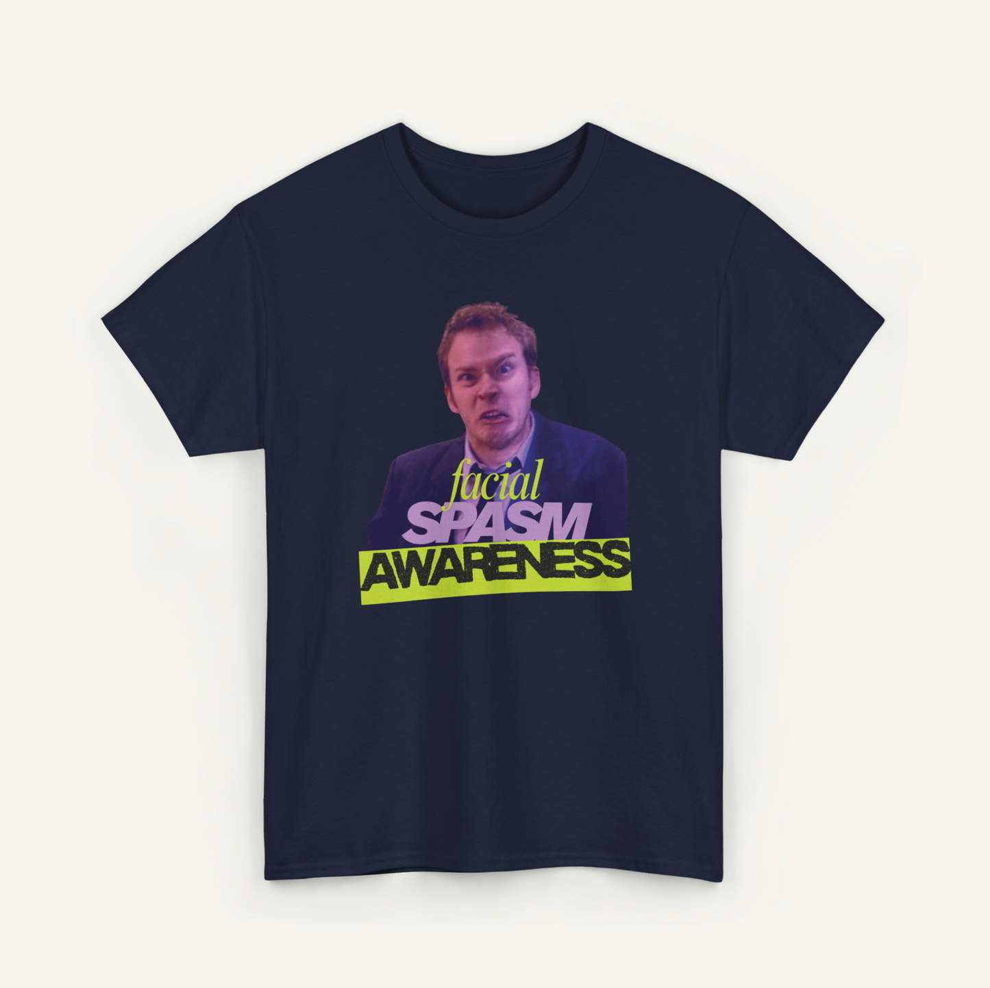 A dark blue t-shirt with a graphic design featuring a man's face and the text "focal SPAM AWARENESS" in yellow and purple.