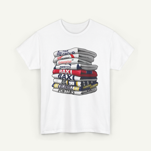 A white t-shirt with a graphic design depicting a stack of various colored books or magazines.