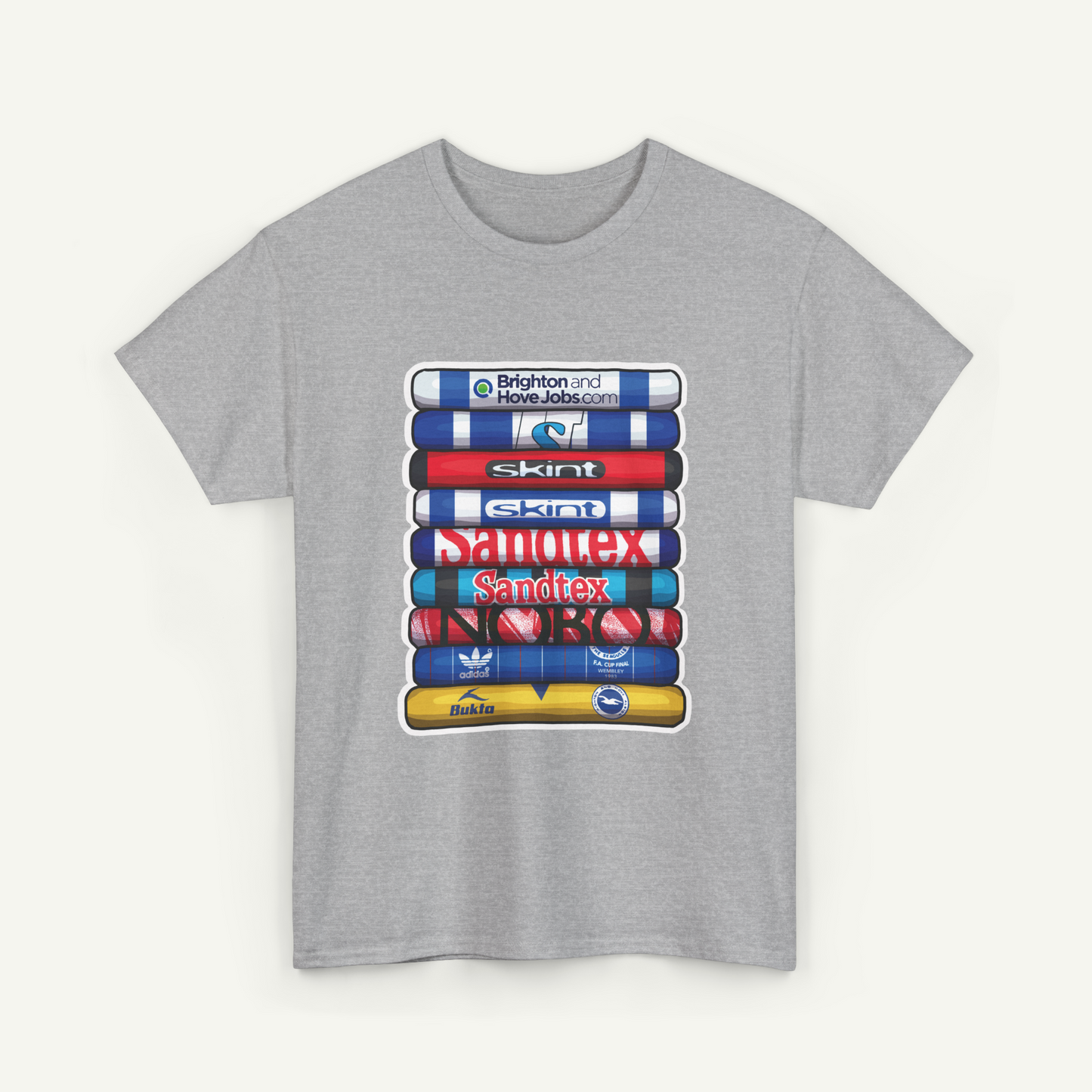 A gray t-shirt with a graphic design featuring a stack of colorful tubes or bottles with various logos and text on them.