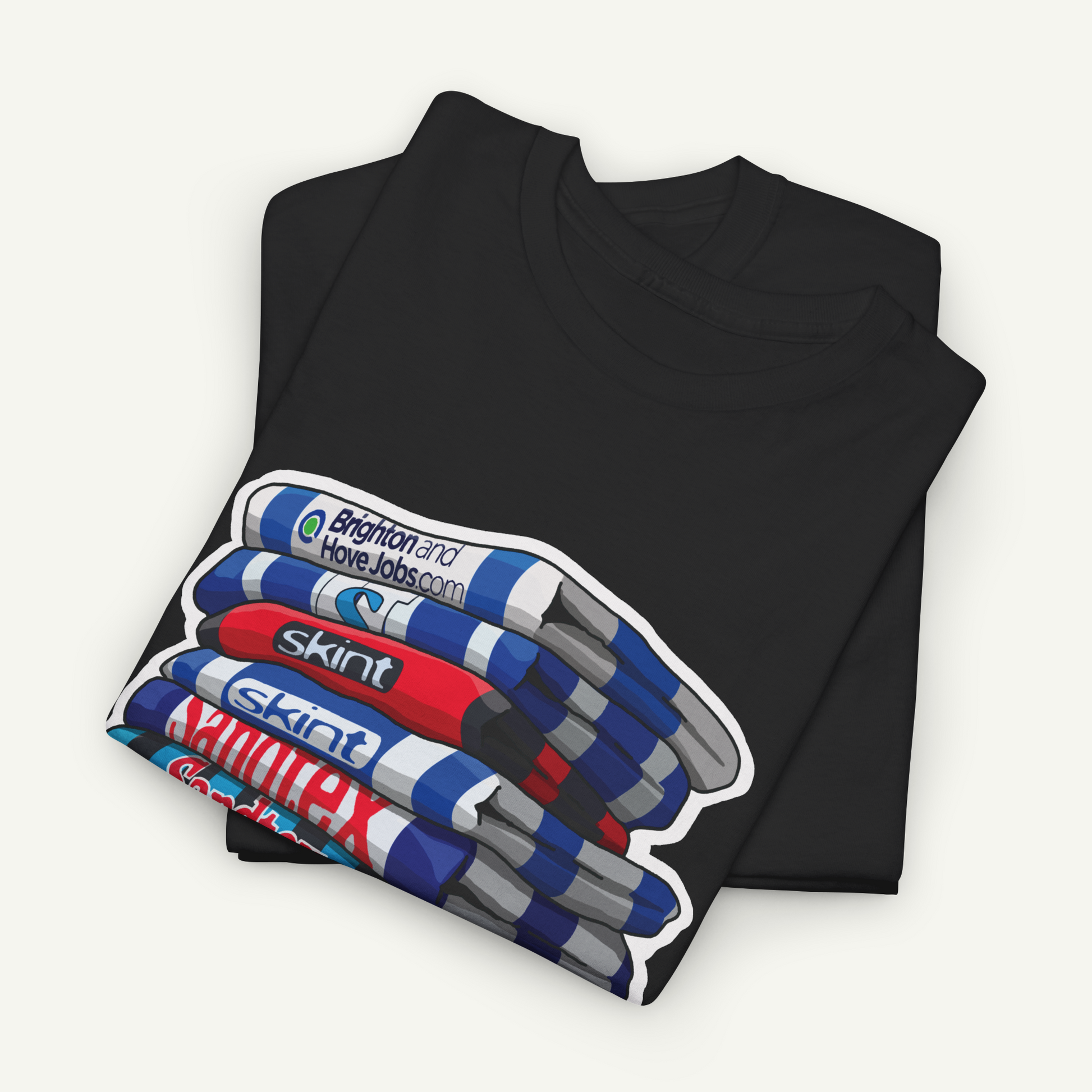 A black t-shirt with a graphic design depicting a stack of colorful markers or highlighters.