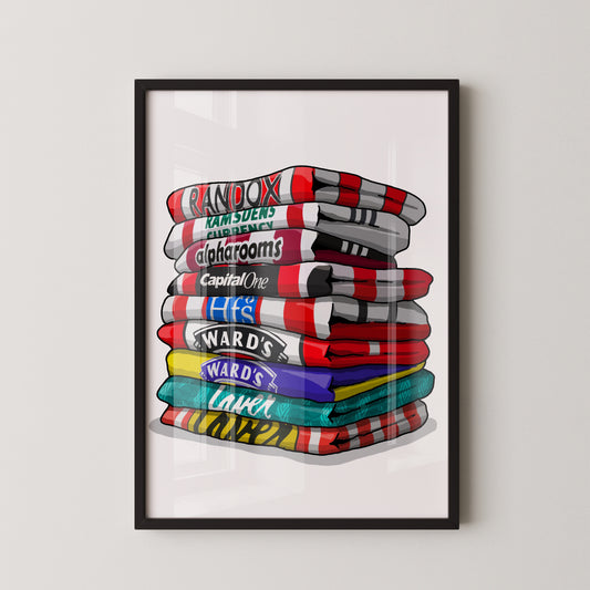 A framed illustration of a stack of colorful towels with various text and logos printed on them.
