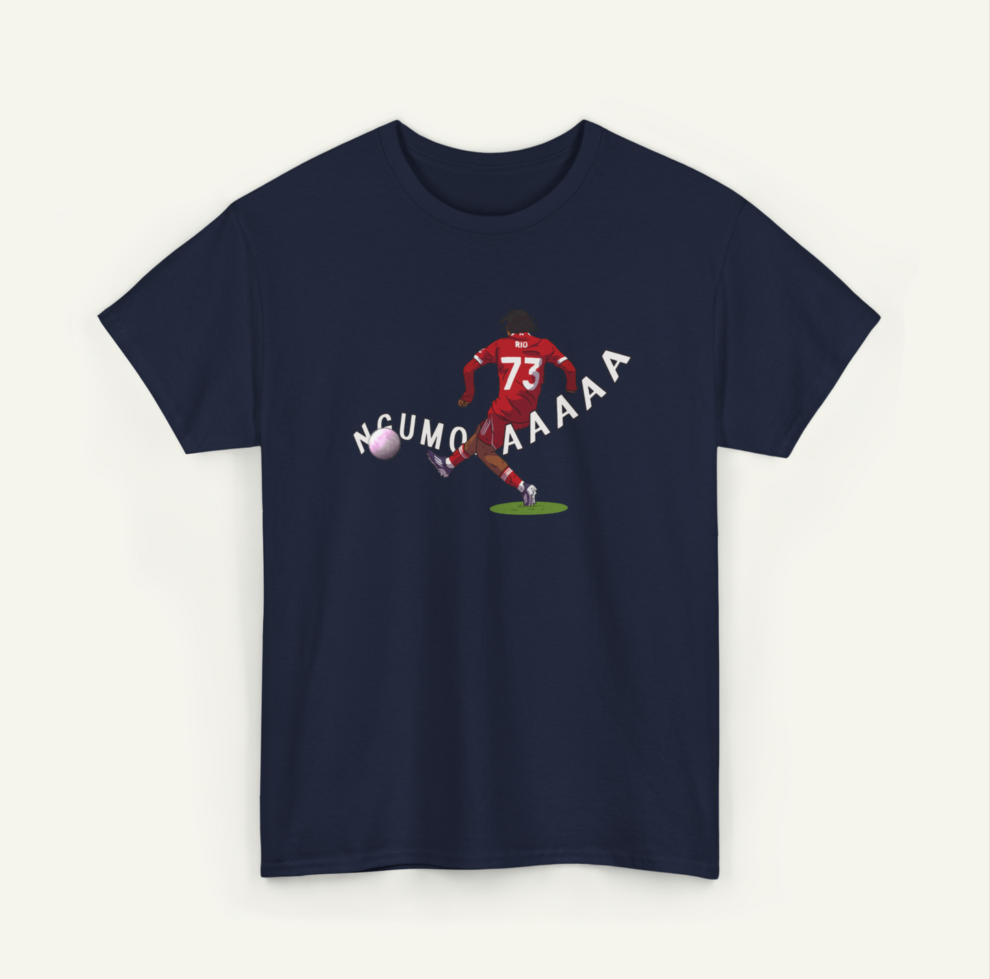A dark blue t-shirt with a graphic design depicting a soccer player kicking a ball, accompanied by the text "NCUMO AAAA" in a playful, humorous font.