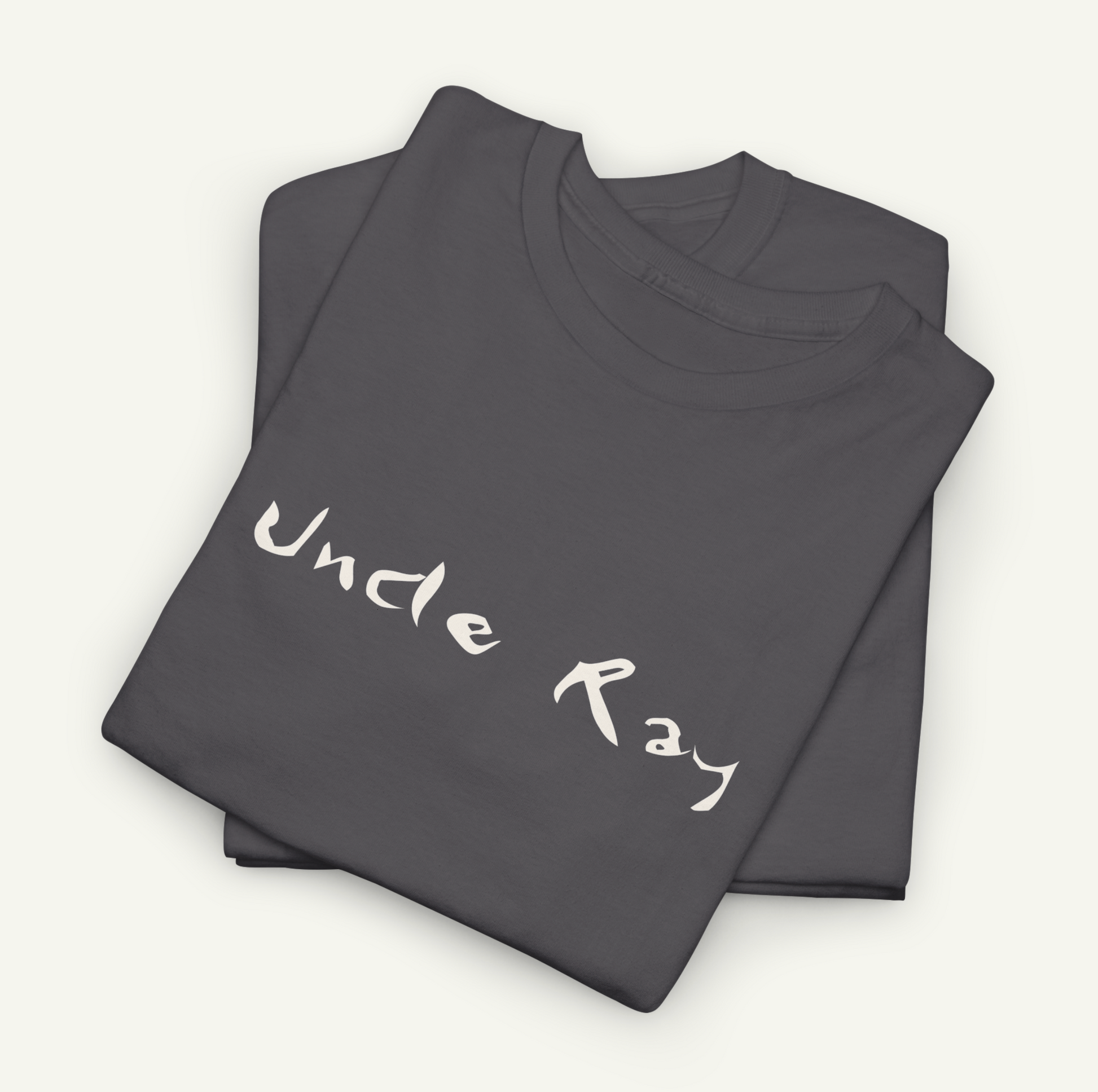 a gray t-shirt with the text "Uncle Ray" printed on it.
