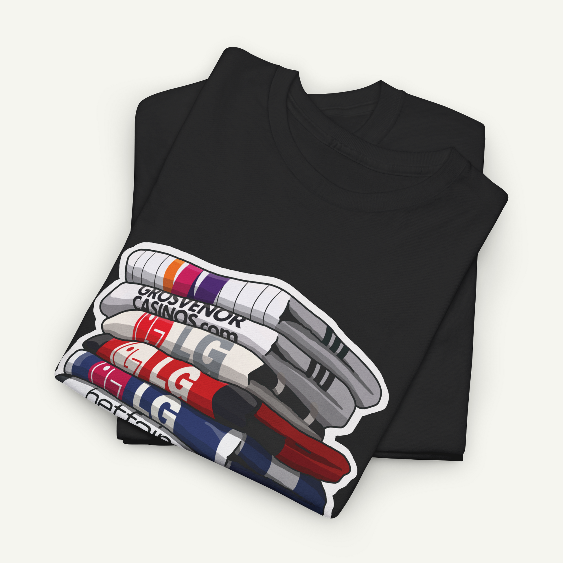 A black t-shirt with a graphic design depicting a stack of colorful markers or pens.