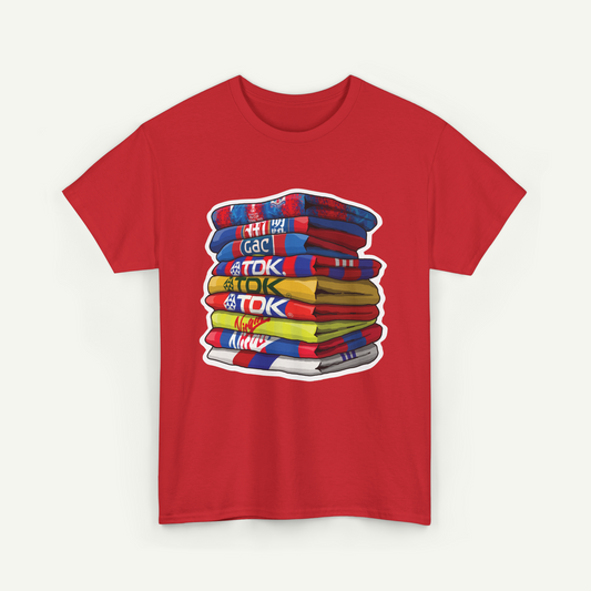 A red t-shirt with a colorful graphic design depicting a stack of various colored towels or blankets.