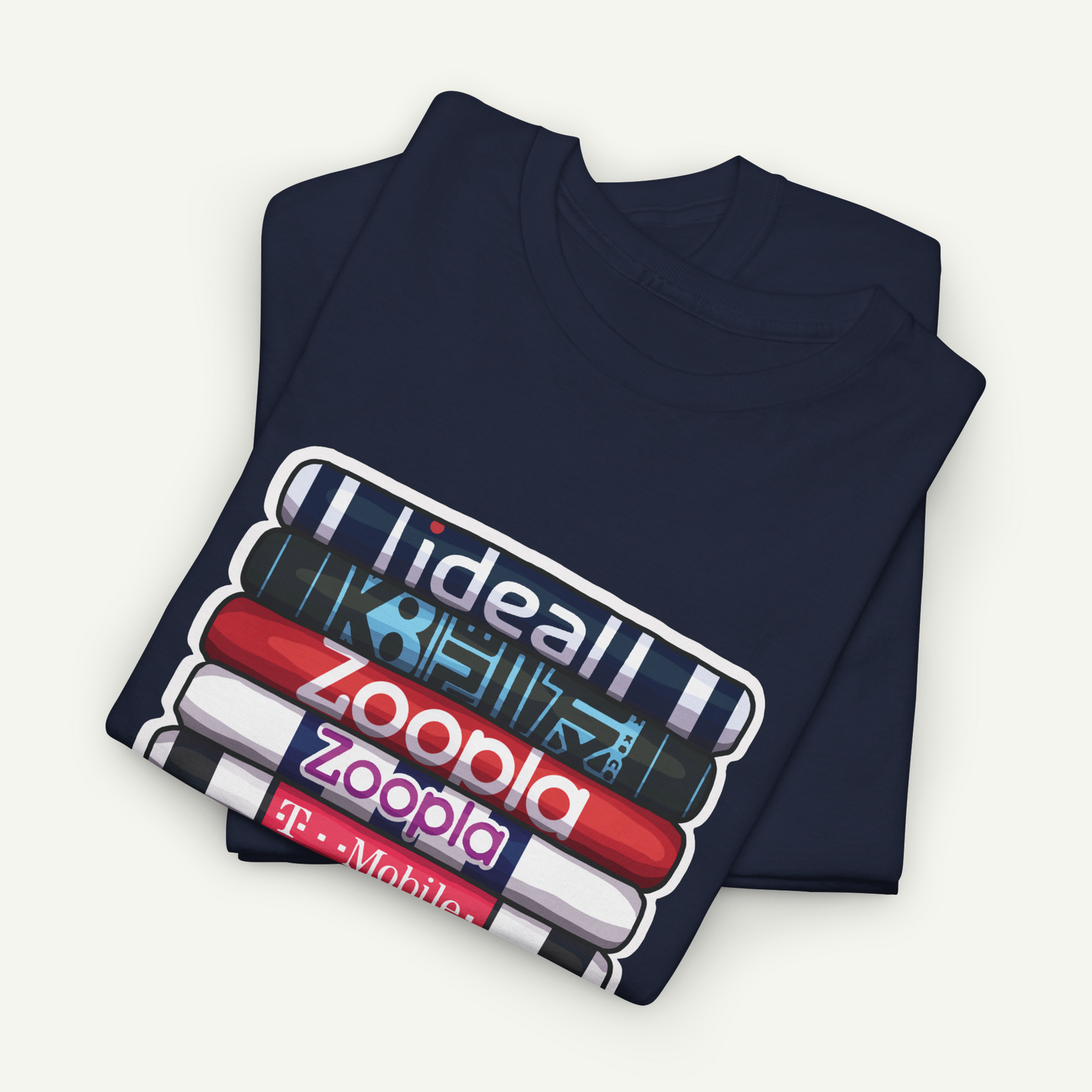 A navy blue t-shirt with a graphic design featuring a stack of colorful books and the text "Zoopla" printed on it.