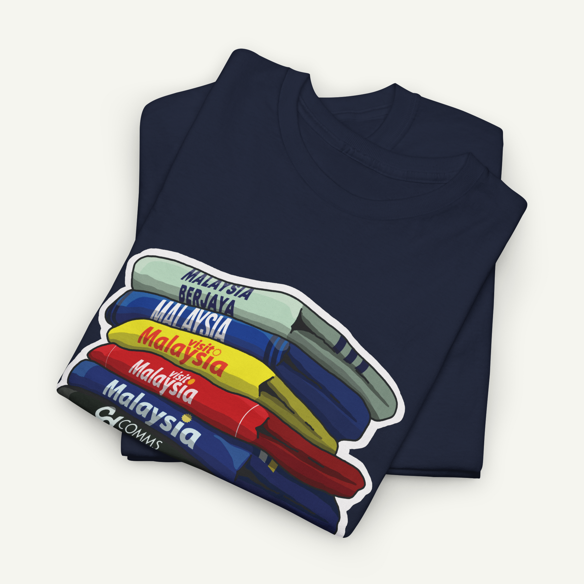 A dark blue t-shirt with a colorful graphic design depicting the countries of Malaysia stacked on top of each other.
