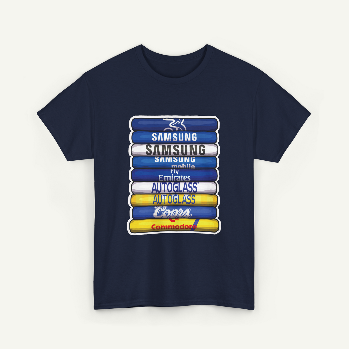 A navy blue t-shirt with a graphic design featuring a stack of seven books or magazines with various text and logos on them.