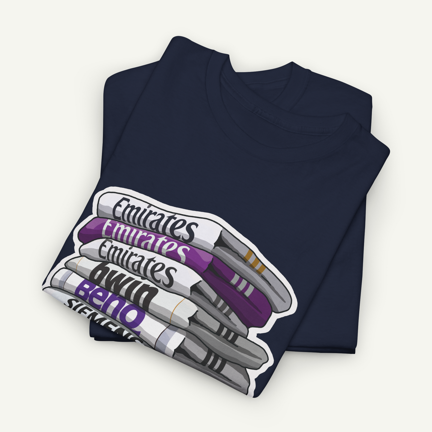 A dark blue t-shirt with a graphic design depicting a stack of pens in various colors, including purple, white, and gray.