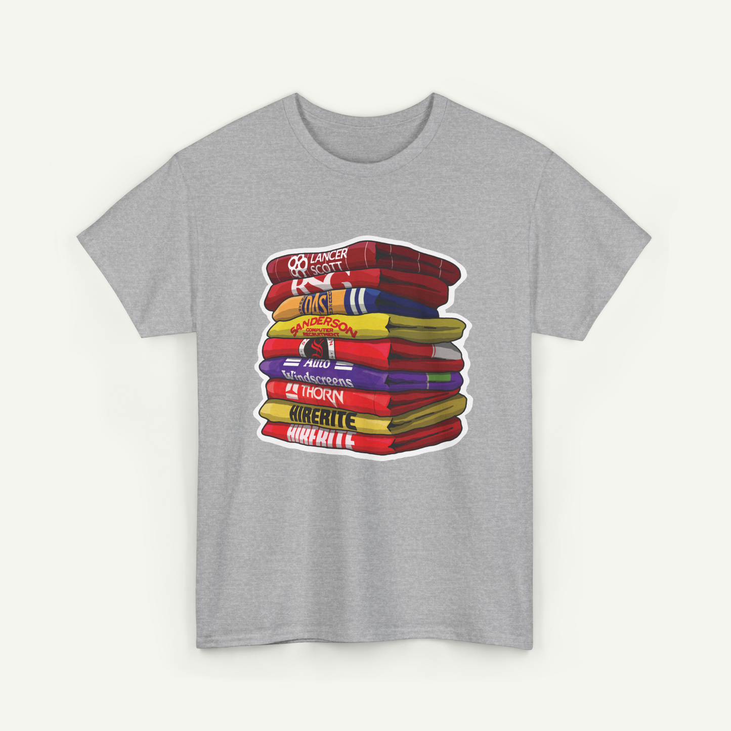 A gray t-shirt with a graphic design depicting a stack of colorful towels or blankets.
