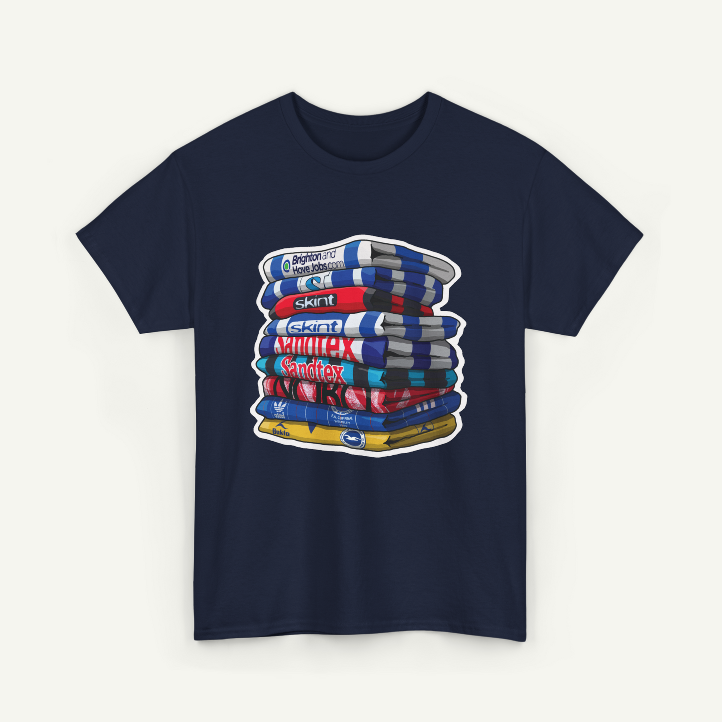 A navy blue t-shirt with a graphic design depicting a stack of colorful books or magazines.