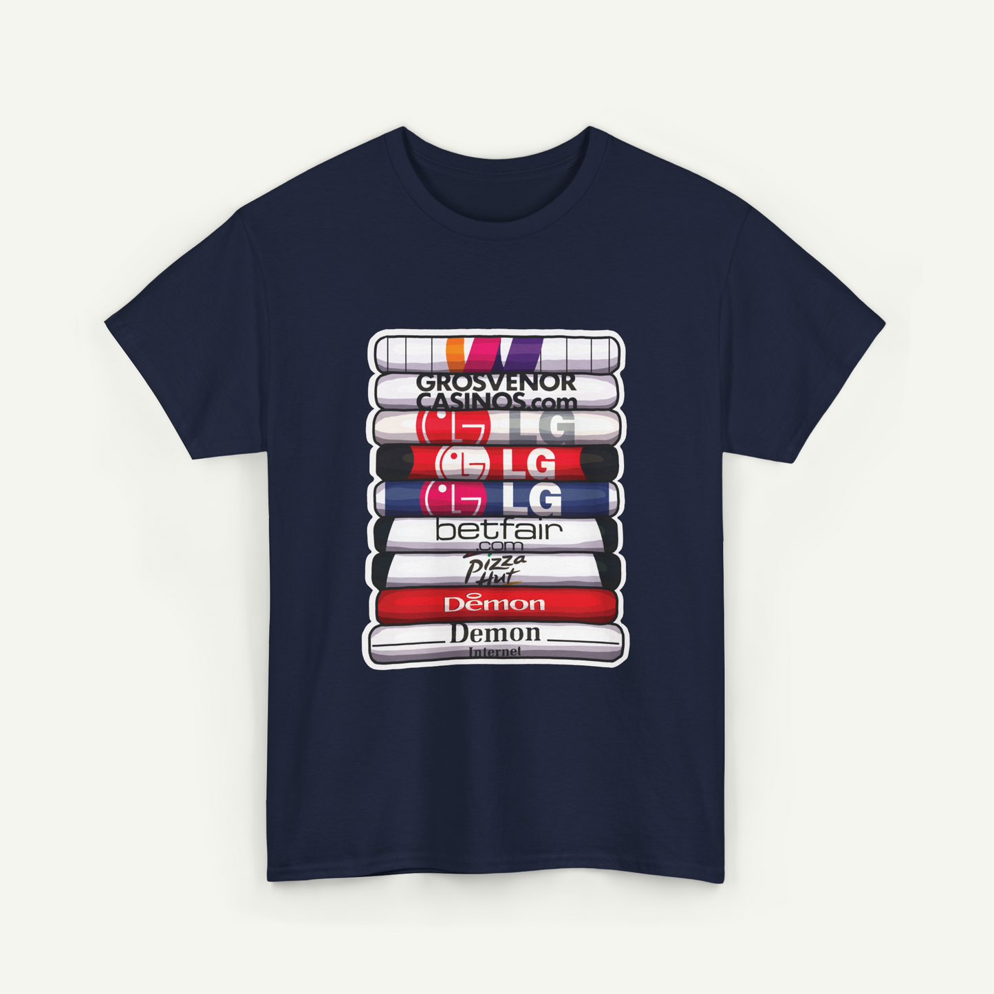 A navy blue t-shirt with a graphic design depicting a stack of colorful books or magazines, each with a different brand logo printed on it.