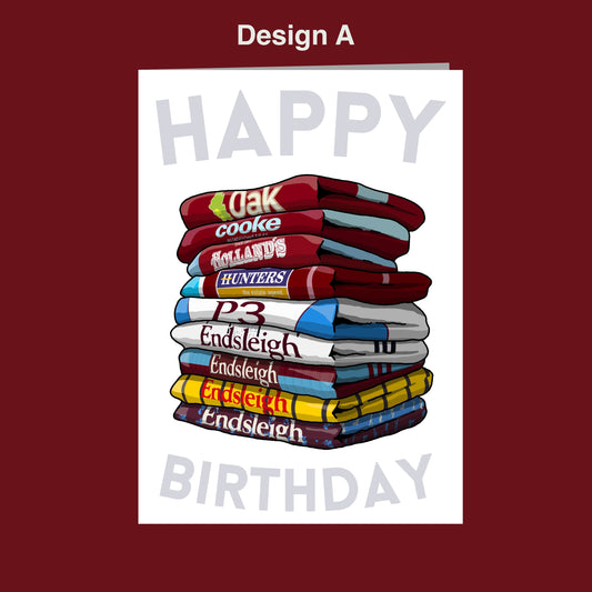 A stack of colorful towels with the text "Happy Birthday" written on them.