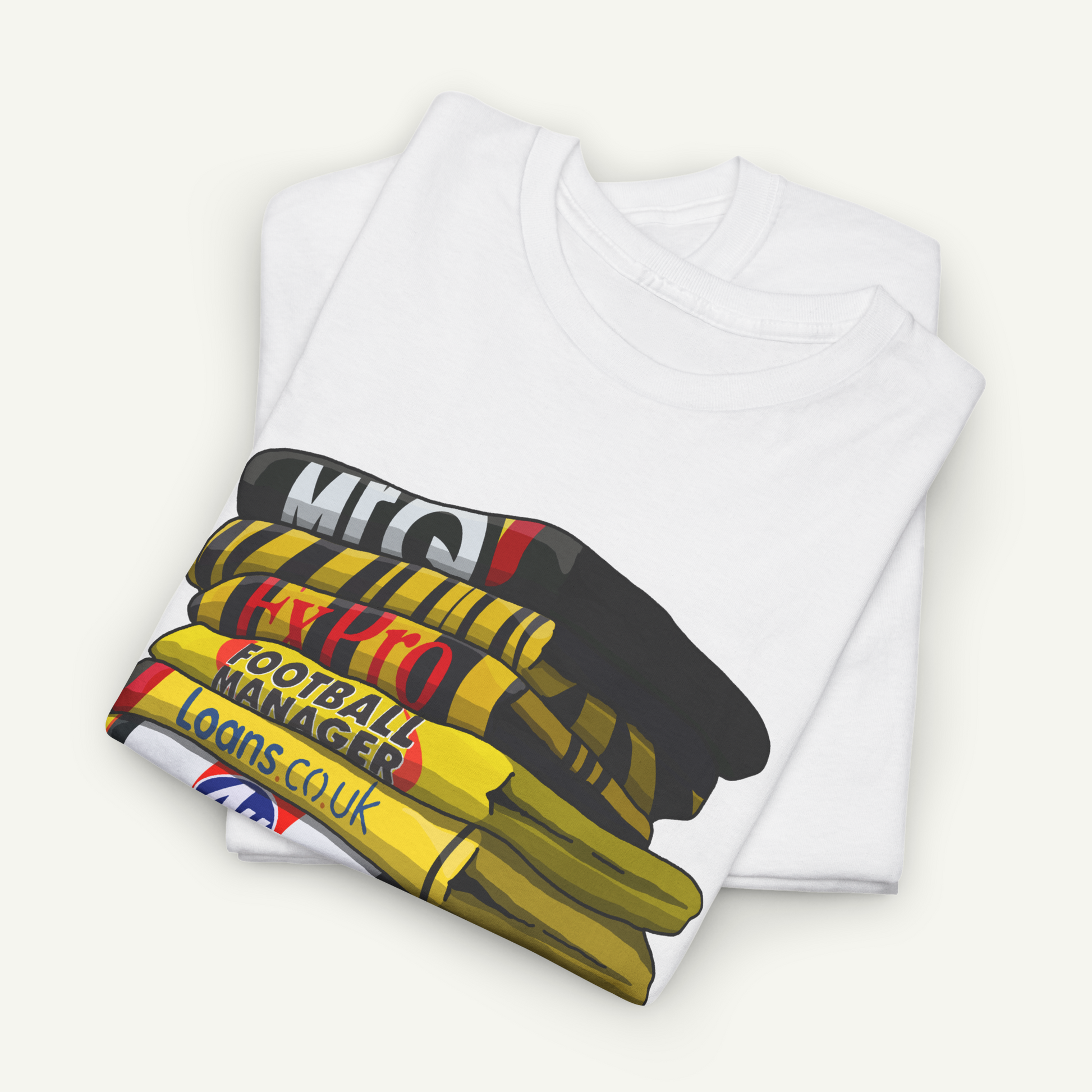 A white t-shirt with a graphic design depicting a stack of football-related items, including a football, a football manager's bag, and a football.