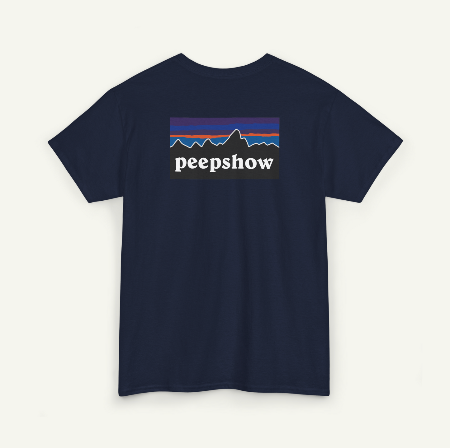 A navy blue t-shirt with a graphic design featuring a mountain range and the text "peepsshow" printed on it.