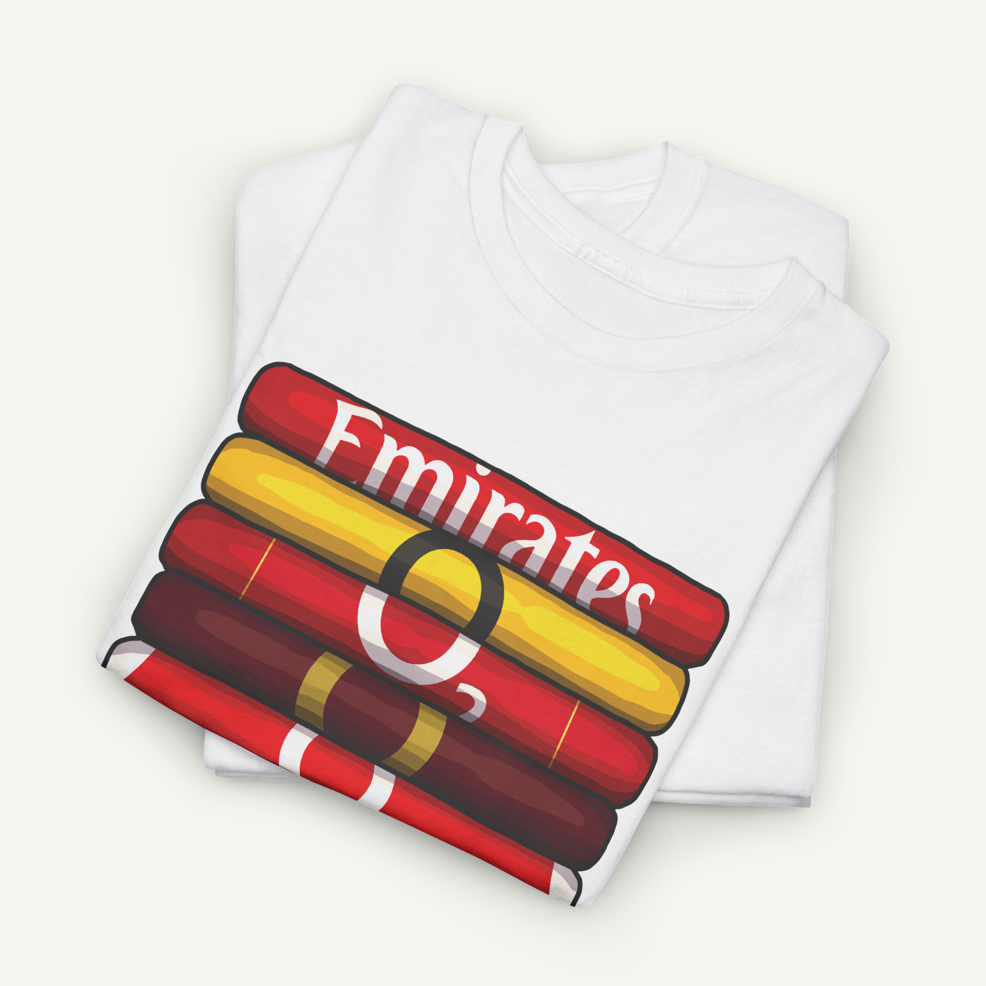 A white t-shirt with a graphic design depicting a stack of books with the word "Emirates" written on them.