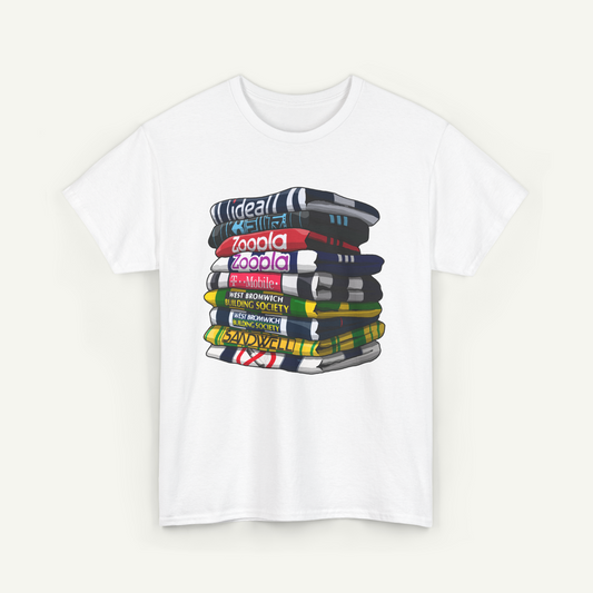 A white t-shirt with a graphic design depicting a stack of colorful books or magazines.