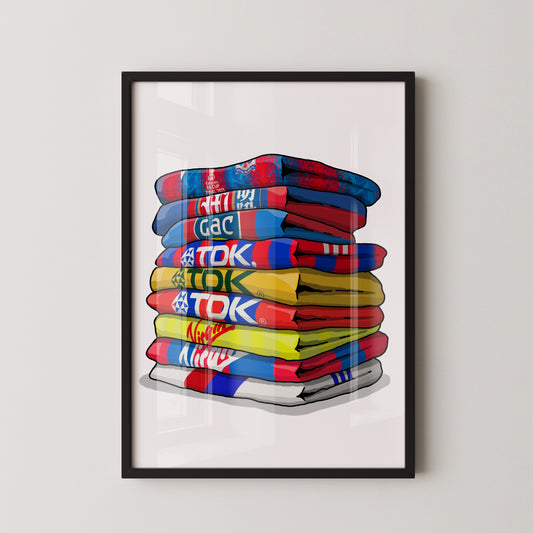 A framed illustration of a stack of colorful towels with various text and logos on them.