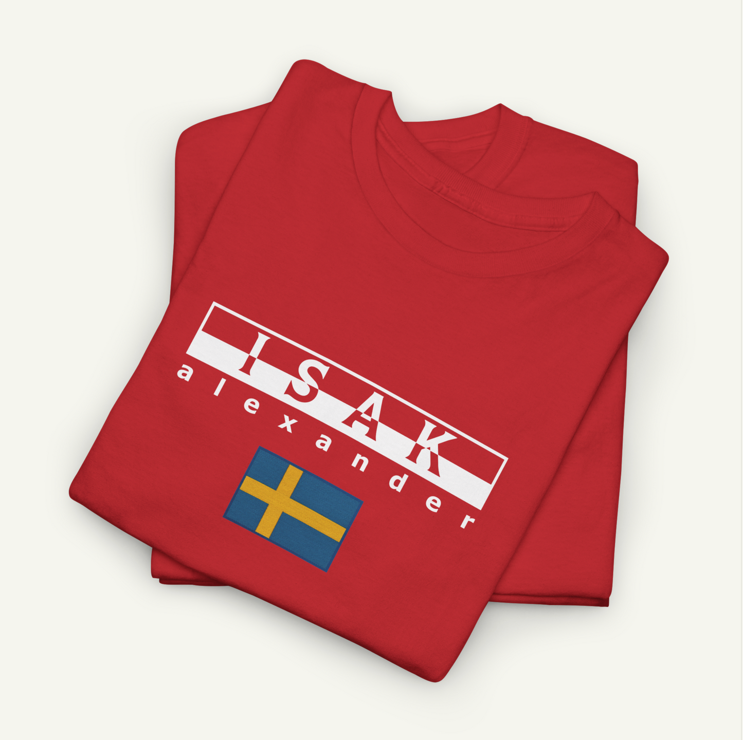 a red t-shirt with the text "ISAK Alexander" printed on it, along with a small flag design.