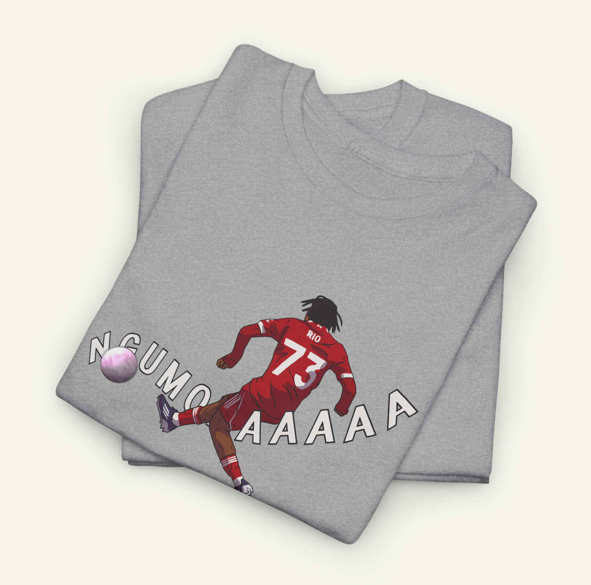 a gray t-shirt with a graphic design depicting a soccer player in a red jersey, kicking a soccer ball.