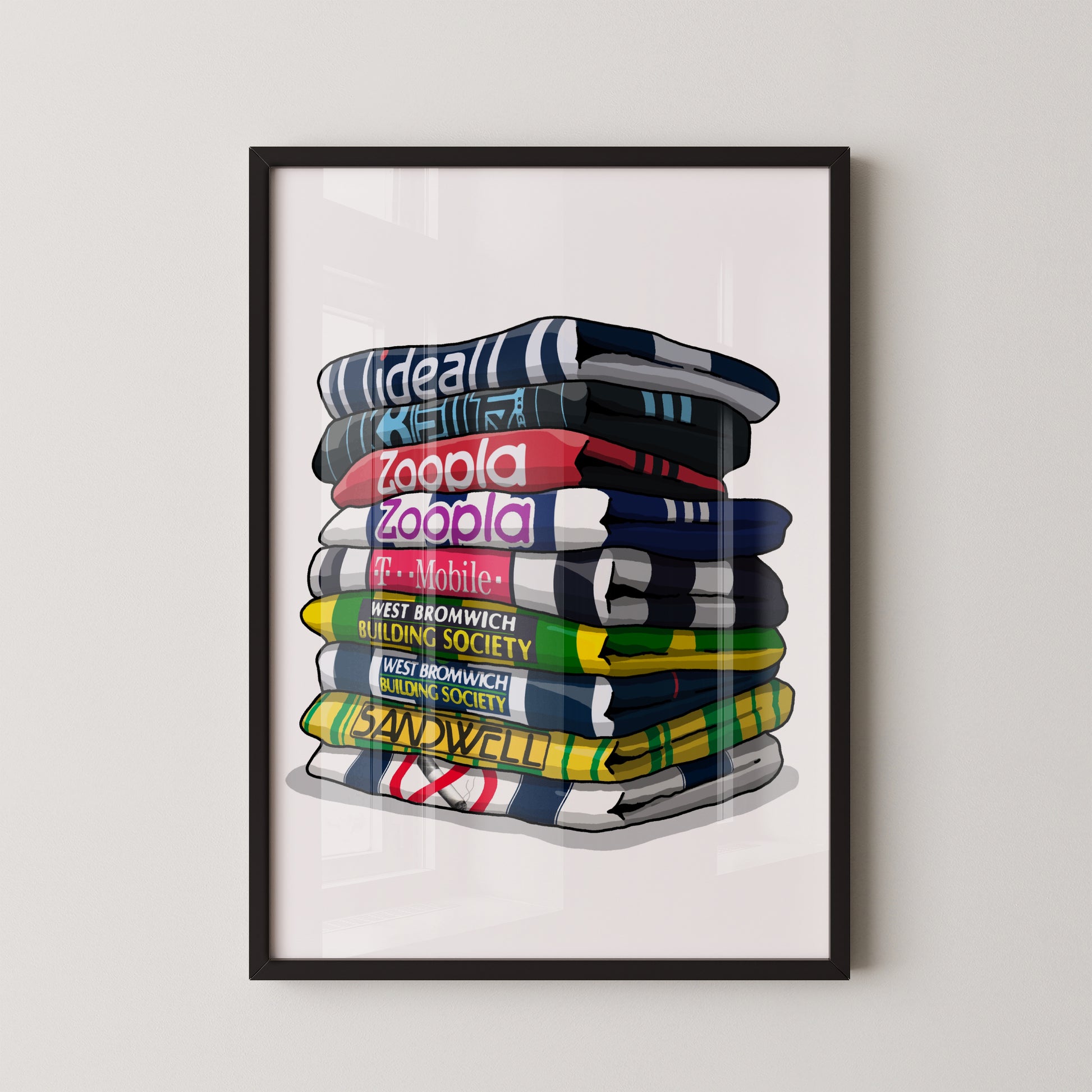 A framed illustration of a stack of colorful towels with various text printed on them.