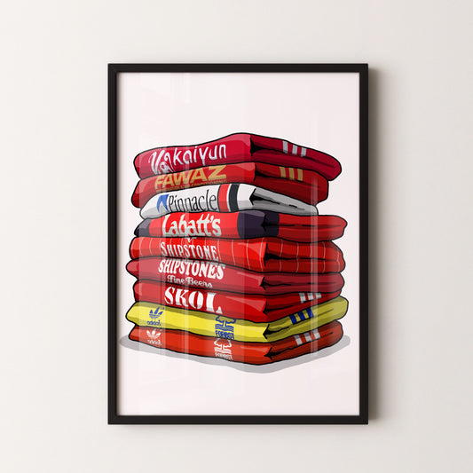 A framed illustration of a stack of various colored towels or blankets, with the text "Vakaiynun", "Fawaz", "Pinnacle", "Labatt's", "SHIPSTONES", "Skoal", and "adidas" printed on them.