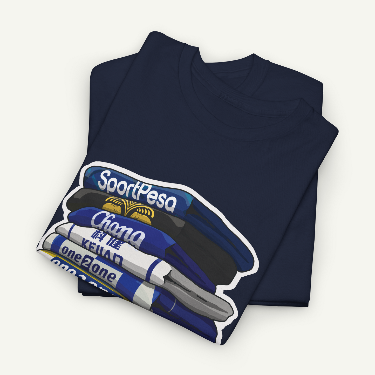 A dark blue t-shirt with a graphic design depicting a stack of books or magazines.